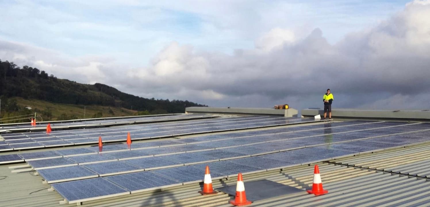 Our technician commissioning a large commercial rooftop solar system